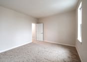 Thumbnail 29 of 54 - an empty living room with white walls and a white door