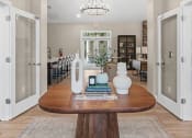 Thumbnail 57 of 74 - a dining room with a table and a chandelier