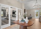 Thumbnail 48 of 74 - an open living room and dining room with a dining room table