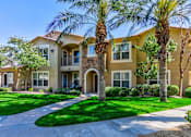 Thumbnail 32 of 41 - A row of houses with palm trees in front.