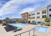 Thumbnail 5 of 27 - Poolside Relaxing Area at Citron Apartment Homes, California