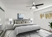 Thumbnail 11 of 18 - A bedroom with a large bed and a ceiling fan.