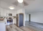Thumbnail 3 of 28 - a kitchen with white cabinets and stainless steel appliances