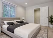 Thumbnail 1 of 23 - Bright bedroom with large mirrored closet and modern décor at Arbor Ranch Apartments.