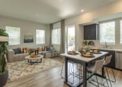Thumbnail 4 of 27 - a living room and kitchen with a table and chairs at Citron Apartment Homes, Riverside, 92506