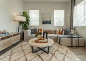 Thumbnail 11 of 27 - a living room with a couch and a coffee table at Citron Apartment Homes, Riverside, 92506