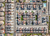 Thumbnail 7 of 33 - A bird's eye view of a residential area with houses and streets.