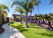 Thumbnail 1 of 24 - Swimming Pool and Spa at Huntington Cove Apartment Homes in Huntington Beach, California.