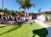 Thumbnail 2 of 24 - Swimming Pool and Spa at Huntington Cove Apartment Homes in Huntington Beach, California.