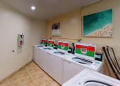 Thumbnail 10 of 24 - Laundry Care Centers at Huntington Cove Apartment Homes in Huntington Beach, California.