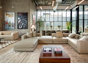 Thumbnail 19 of 29 - A modern living room with a large window and a variety of seating options.