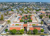 Thumbnail 15 of 25 - A view of a residential area with houses and palm trees.