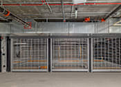 Thumbnail 29 of 29 - A large, empty industrial space with metal grates on the doors.