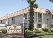Thumbnail 10 of 14 - the front of the sandpiper apartment homes building