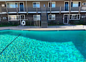 Thumbnail 14 of 32 - Towne Centre at Orange Apartments with swimming pool.