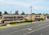 Thumbnail 8 of 32 - A street view of a residential area with a sign that reads "BROOKHURST".