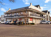 Thumbnail 22 of 22 - building with a balcony at Eastover Commons Residential, Jackson, MS  
