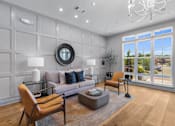 Thumbnail 3 of 22 - living room with a grey couch at Eastover Commons Residential, Jackson Mississippi