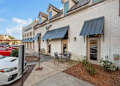 Thumbnail 5 of 22 - white building with a black awning at Eastover Commons Residential, Mississippi