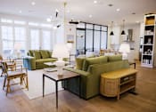 Thumbnail 8 of 22 - living room with a green couch at Eastover Commons Residential, Jackson, MS  