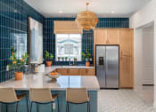 Thumbnail 16 of 35 - at Pillar at Fountain Hills clubhouse with kitchen and bar seating