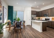 Thumbnail 30 of 35 - Pillar at Fountain Hills vinyl wood plank flooring  and island in the kitchens of Pillar at Fountain Hills, AZ