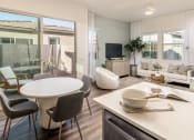 Thumbnail 27 of 35 - Apartment with dining room table and living room at Pillar at Fountain Hills