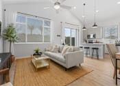 Thumbnail 8 of 31 - a living room with a couch and a table at Village of Chandler Apartments, Chandler