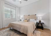 Thumbnail 15 of 31 - a bedroom with a large bed and a window at Village of Chandler Apartments, Arizona