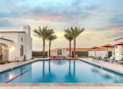 Thumbnail 1 of 35 - Pillar at Fountain Hills Relaxing pool with palm trees