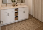 Thumbnail 7 of 10 - A bathroom with a white vanity and a shower curtain.