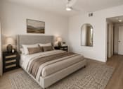 Thumbnail 10 of 10 - A bedroom with a large bed and a painting on the wall.