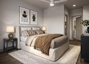 Thumbnail 1 of 10 - A bedroom with a large bed and a ceiling fan.