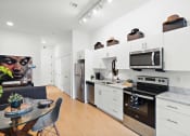 Thumbnail 12 of 24 - Kitchen with appliances at The Freelon at Sugar Hill, Detroit, MI 48201