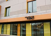 Thumbnail 10 of 10 - A building with a sign that says "K12" on the front.