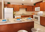 Thumbnail 16 of 27 - Apartments with upgraded kitchen, chestnut-colored cabinets, kitchen island, breakfast bar, lots of cabinet space, lots of counter space at Alpine Village Apartments in La Vista, Nebraska