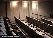 Thumbnail 19 of 42 - Resident private movie theater at The Biltmore Apartments in Omaha, Nebraska