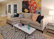 Thumbnail 26 of 41 - Spacious apartment in central Omaha with condo-style layout, white kitchen cabinets, kitchen island, and built-in shelves at Embassy Park Apartments
