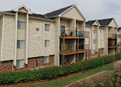 Thumbnail 12 of 27 - Apartments in central Omaha with lots of trees and lush landscaping, scenic views, and park-like setting at Kensington Woods Apartments