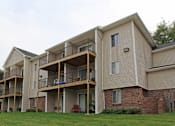 Thumbnail 20 of 27 - Apartments in central Omaha with lots of trees and lush landscaping, scenic views, and park-like setting at Kensington Woods Apartments