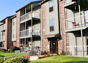 Thumbnail 14 of 35 - Green and red brick exterior, beautiful landscaping, scenic views, lots of trees, and spacious balconies at LionsHead Apartments in Omaha, Nebraska