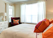 Thumbnail 34 of 36 - Large bedroom with large walk-in closet, crown molding, and 9-12 foot ceilings.