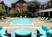 Thumbnail 3 of 36 - Luxury swimming pool with relaxing sundeck at Tuscany Apartments in Houston.