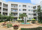 Thumbnail 11 of 29 - Luxury apartments in the Las Colinas area with a beautiful courtyard, landscaped courtyard, luxury courtyard, fountain, zen garden, and firepit