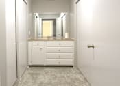 Thumbnail 15 of 27 - Recently updated apartments with gray wall color, white cabinets, and extra storage space at Kensington Woods Apartments in Omaha, Nebraska
