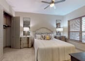 Thumbnail 10 of 42 - Spacious master bedroom to accommodate a king-size bed and dresser with walk-in closet and master bathroom at Tuscany Walk Apartments in Houston Texas.