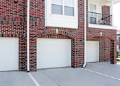 Thumbnail 31 of 31 - Luxury townhomes with attached garages and red brick exterior next to Rockledge Shopping Center in South Lincoln Nebraska