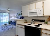 Thumbnail 41 of 44 - Spacious kitchen with extra cabinet space, extra counter space, tiled floors, bright white kitchen, at Tanglewood Apartments in Lincoln, Nebraska
