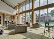 Thumbnail 8 of 42 - Huge clubhouse with spacious resident lounge, free wi-fi, coffee bar, and fitness center at Woodlake on the Bayou Apartments in Houston.