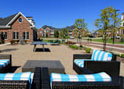 Thumbnail 33 of 46 - Luxury apartments with swimming pool, poolside lounges, grilling station, ping-pong table and brick exteriors at Bellemeade Apartments in west Des Moines
